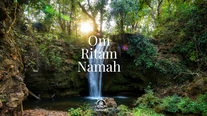 Monday Mantray ~ Om Ritam Namah A tranquil waterfall in a lush forest with sunlight piercing through the trees, featuring the text "Om Ritam Namah" and a logo at the bottom center.